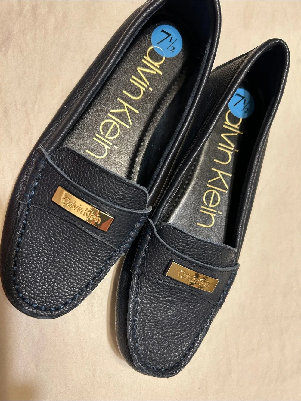 Calvin Klein Women's Navy Leather Moccasin Loafers with Gold Plaque